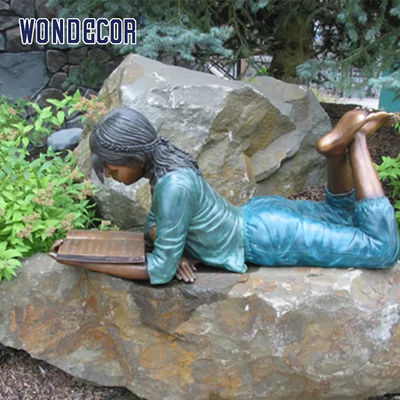 Customized outdoor garden decoration, life-size bronze statue of a girl reading on her stomach