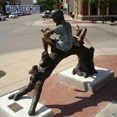 Custom Life Size Bronze statues of companions sitting on arched tree trunks reading together