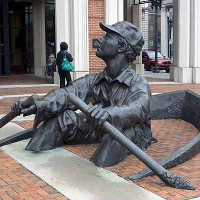 People Rowing Boats Bronze Statues Sculpture On Streets Of Park Square