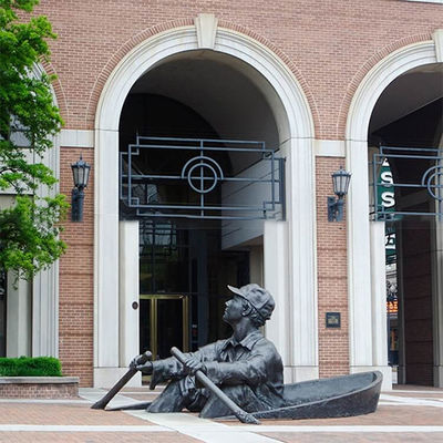 People Rowing Boats Bronze Statues Sculpture On Streets Of Park Square
