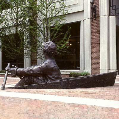 People Rowing Boats Bronze Statues Sculpture On Streets Of Park Square