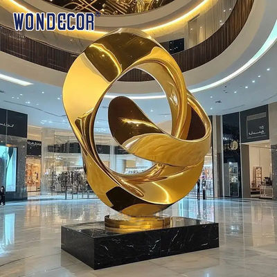 Large indoor hotel lobby Pop Art golden stainless steel statue