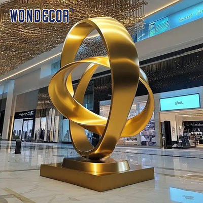 Large indoor hotel lobby Pop Art golden stainless steel statue
